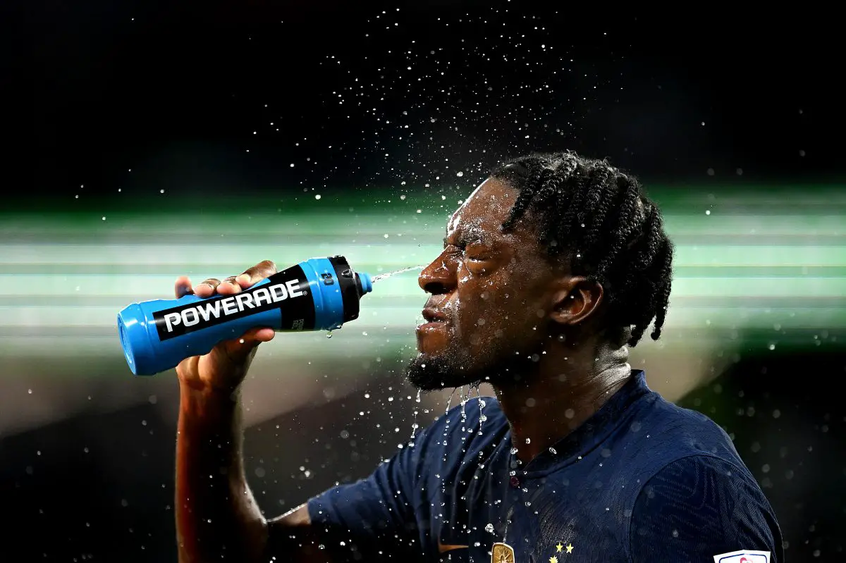 Axel Disasi of France sprays water on his face during their World Cup semi-final against Morocco. 