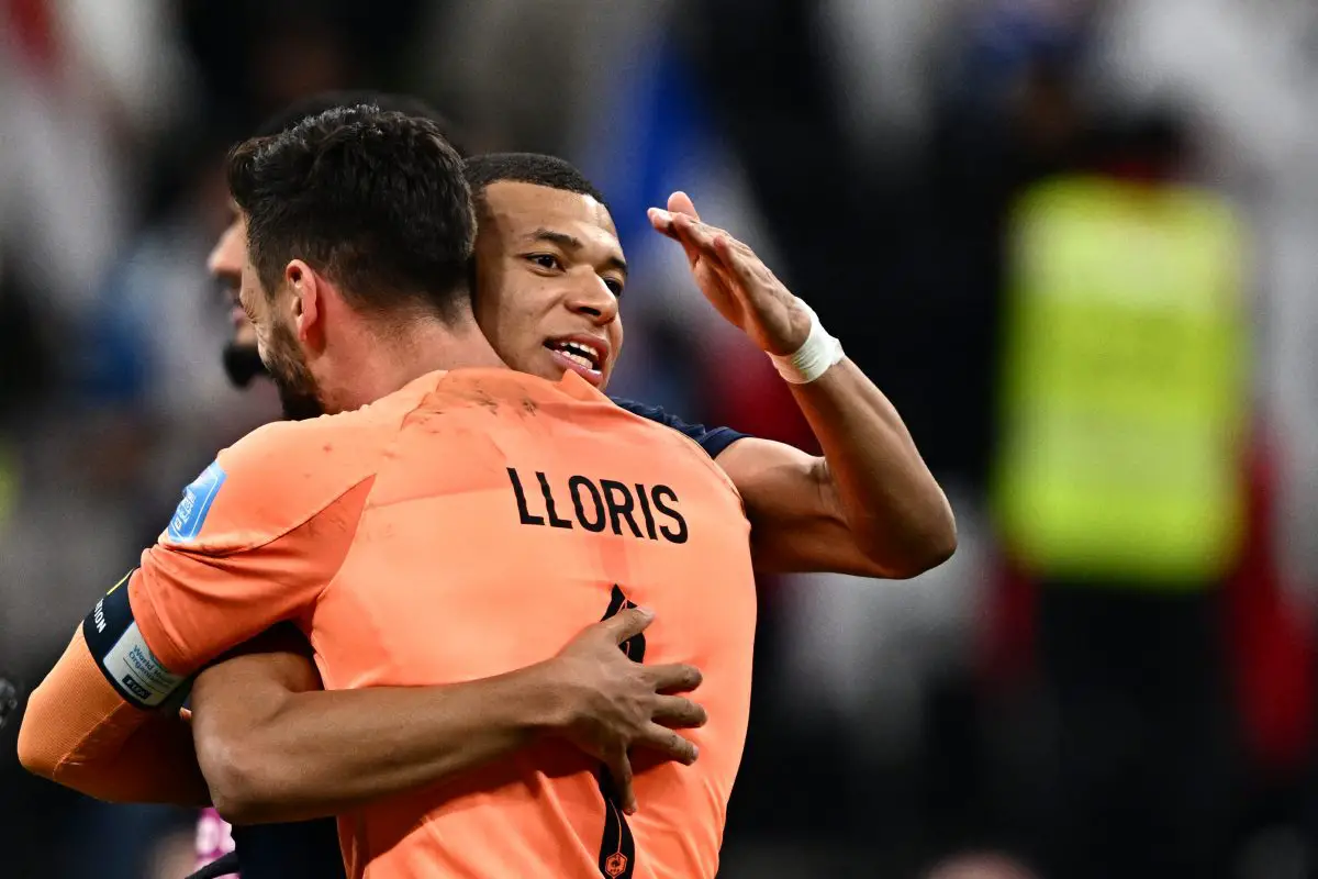 Kylian Mbappe with France teammate Hugo Lloris. (Photo by GABRIEL BOUYS/AFP via Getty Images)