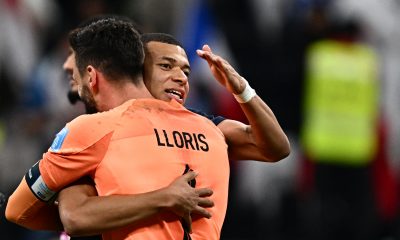 Kylian Mbappe with France teammate Hugo Lloris. (Photo by GABRIEL BOUYS/AFP via Getty Images)