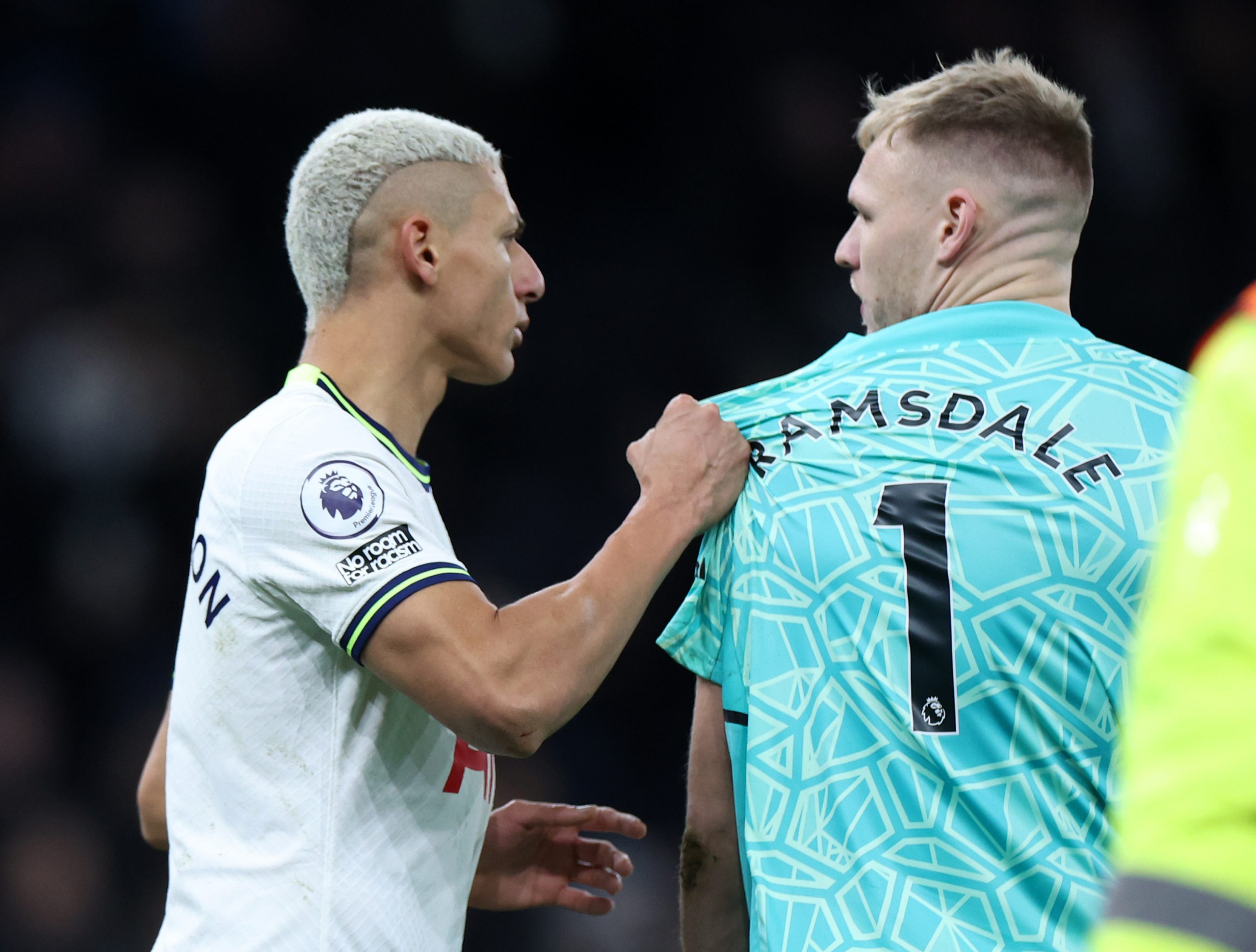 Richarlison of Tottenham Hotspur clashes with Aaron Ramsdale of Arsenal at full time - January 2023. (Photo by Catherine Ivill/Getty Images)