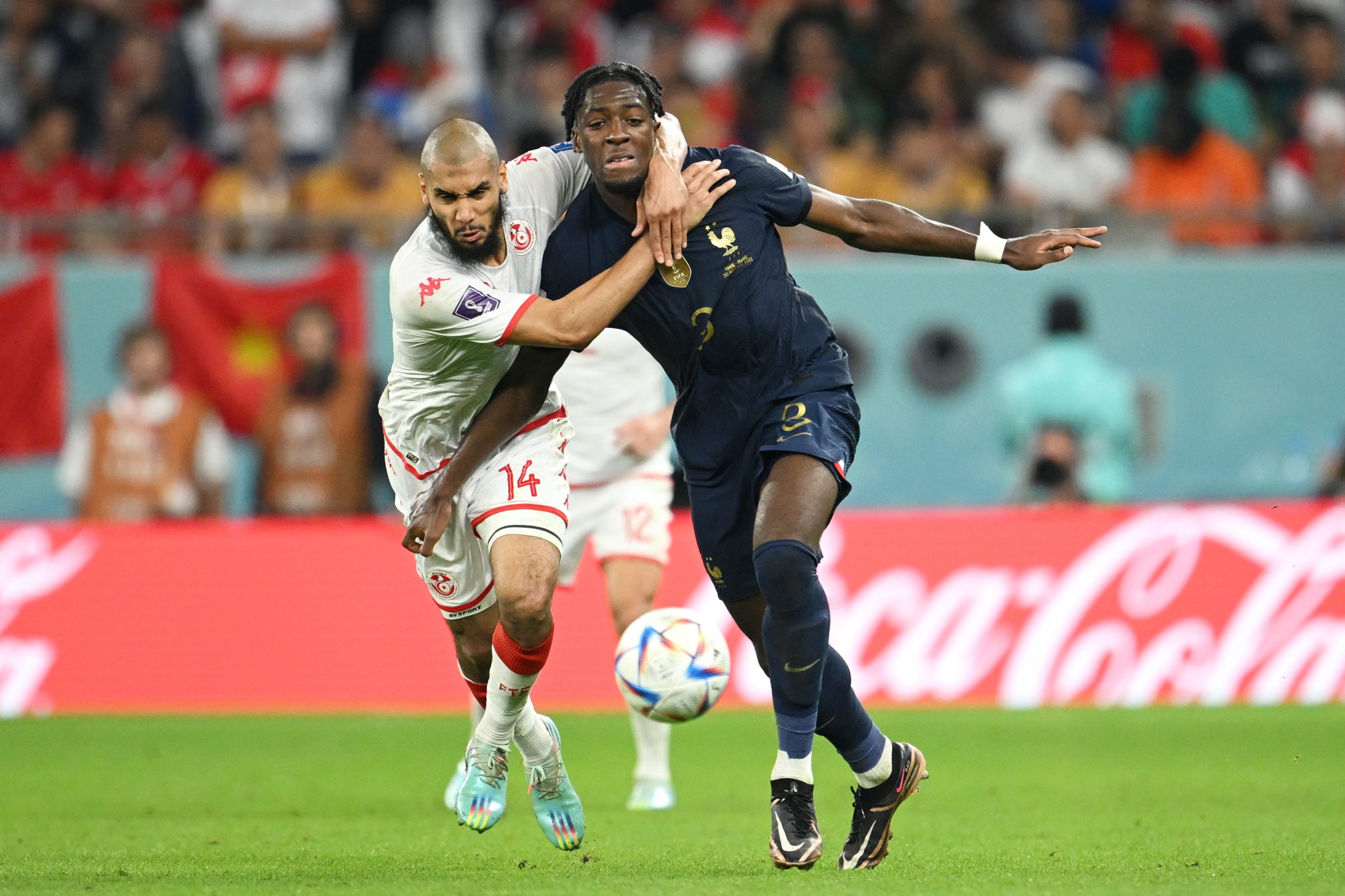 AL RAYYAN, QATAR - NOVEMBER 30: Axel Disasi of France is challenged by Aissa Laidouni of Tunisia during the FIFA World Cup Qatar 2022 Group D match between Tunisia and France at Education City Stadium on November 30, 2022 in Al Rayyan, Qatar. (Photo by Clive Mason/Getty Images)