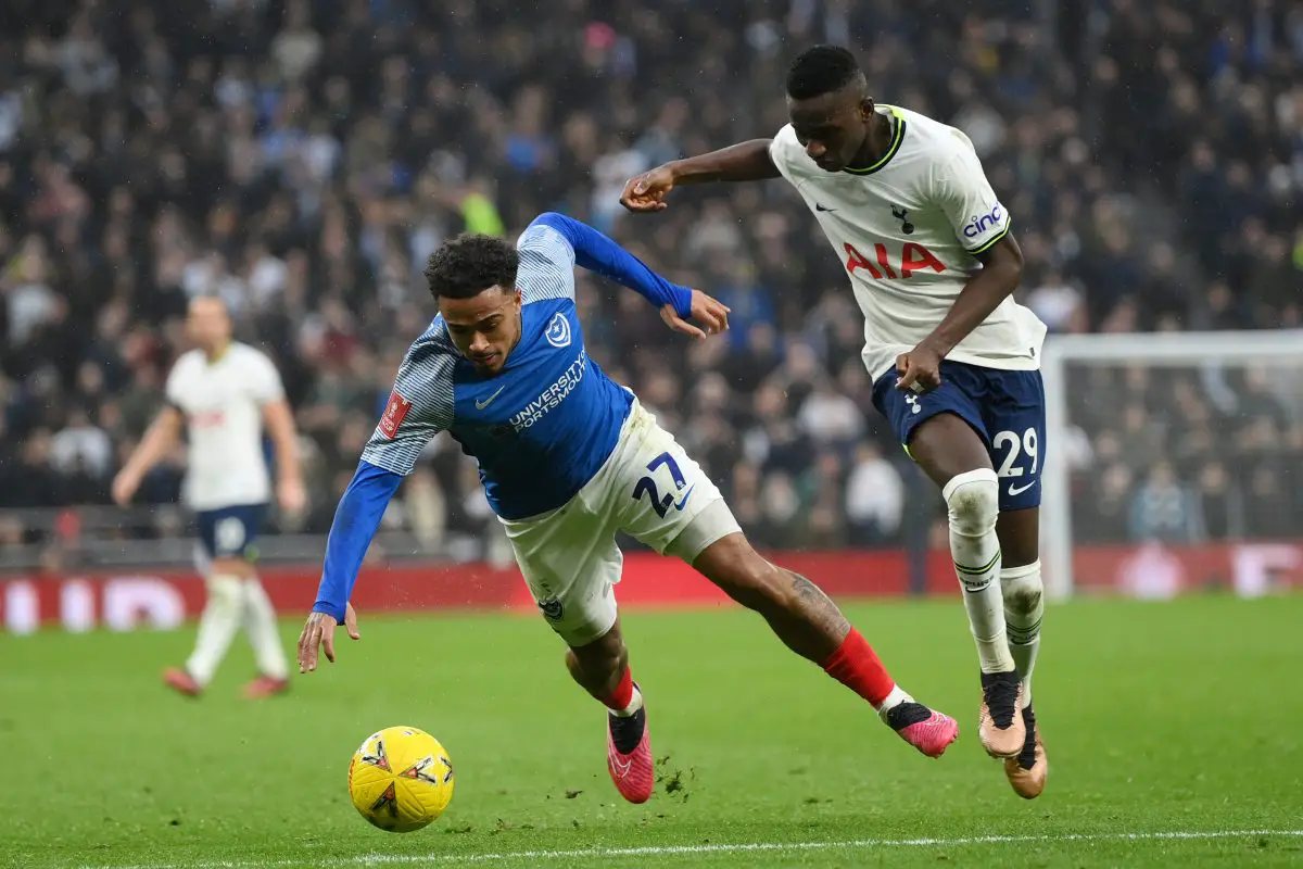 Josh Koroma of Portsmouth battles for possession with Pape Matar Sarr of Tottenham Hotspur. 