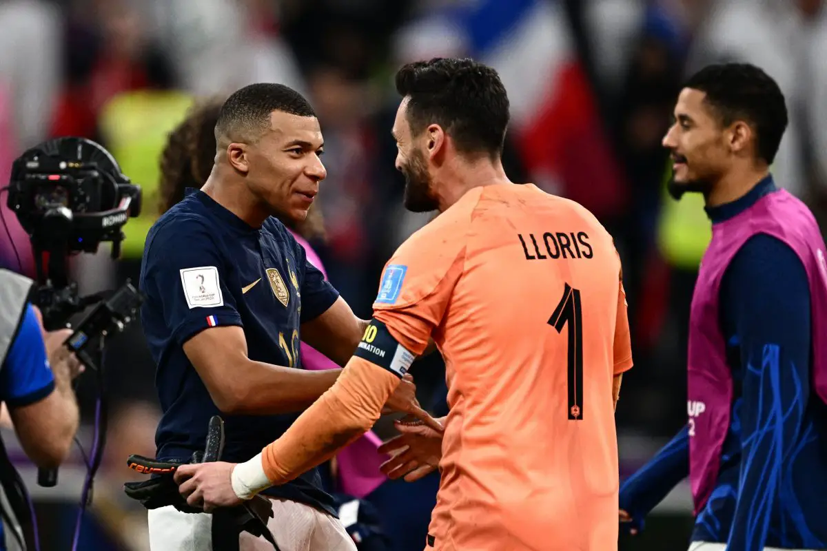 PSG's Kylian Mbappe with Tottenham Hotspur's Hugo Lloris for France. (Photo by GABRIEL BOUYS/AFP via Getty Images)