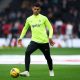 Cristian Romero of Tottenham Hotspur warms up prior to the Premier League match between Tottenham Hotspur and Aston Villa at Tottenham Hotspur Stadium on January 01, 2023 in London, England. (Photo by Eddie Keogh/Getty Images)