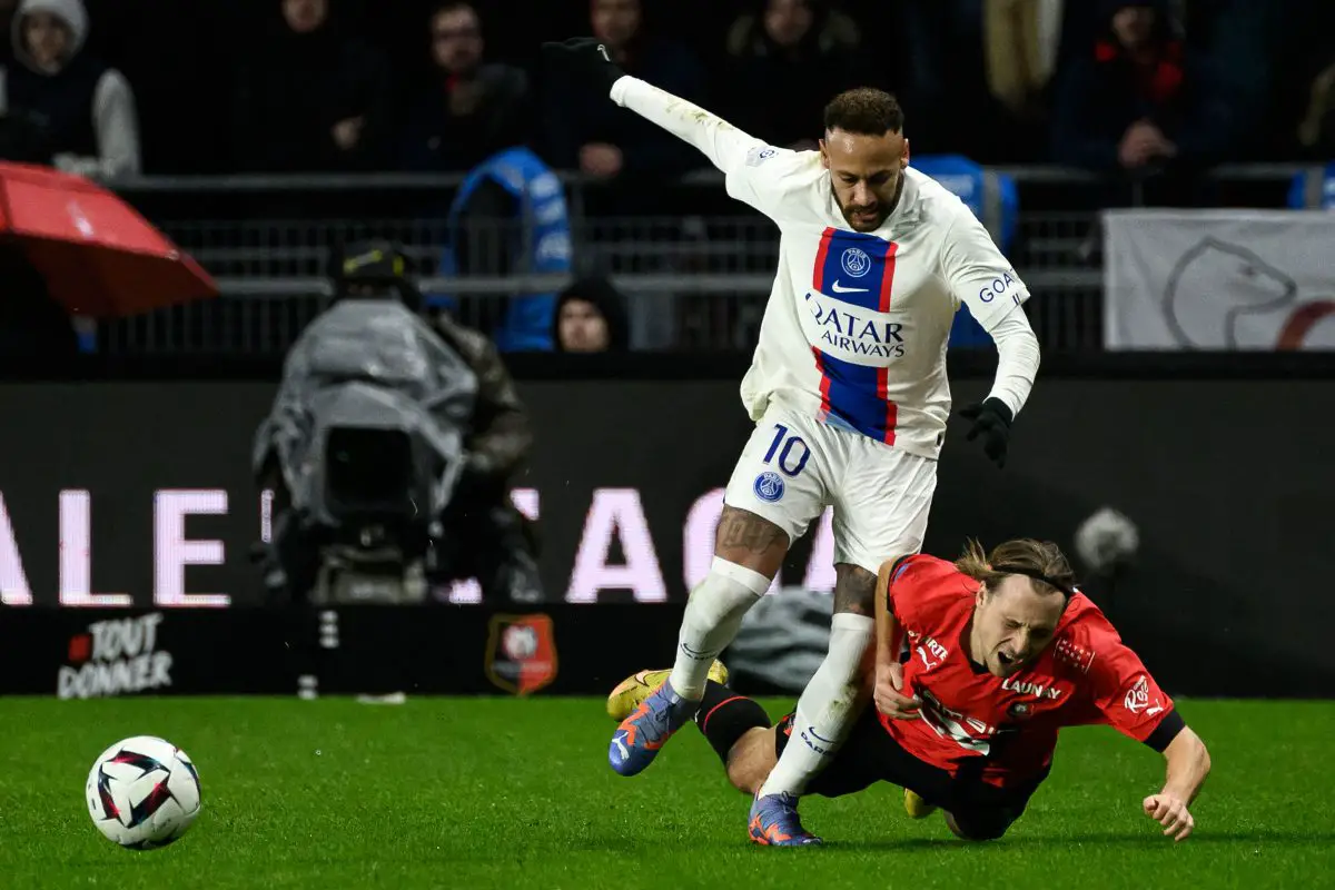Paris Saint-Germain's Neymar fights for the ball with Rennes' Lovro Majer. 