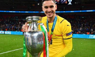 Alex Meret of Italy celebrates with The Henri Delaunay Trophy following his team's victory in the UEFA Euro 2020 Championship Final against England.