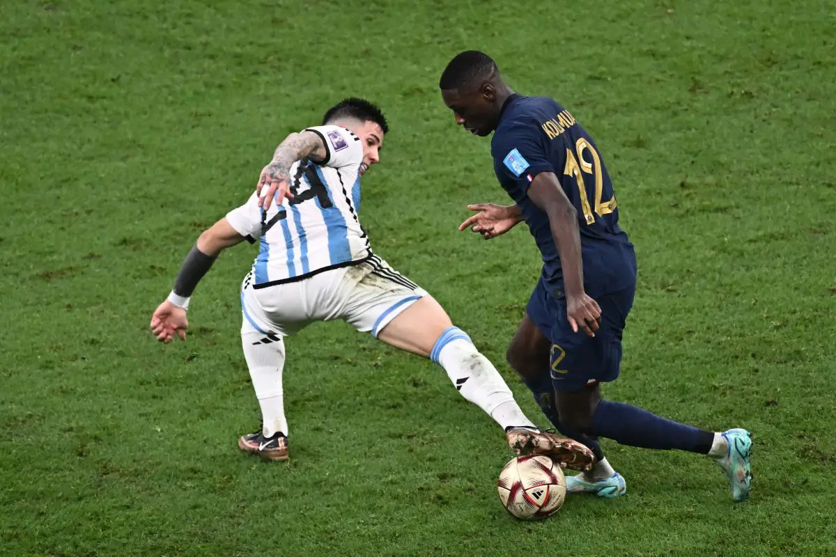 Argentina's Enzo Fernandez battles for possession with Randal Kolo Muani of France. (Photo by JEWEL SAMAD/AFP via Getty Images)