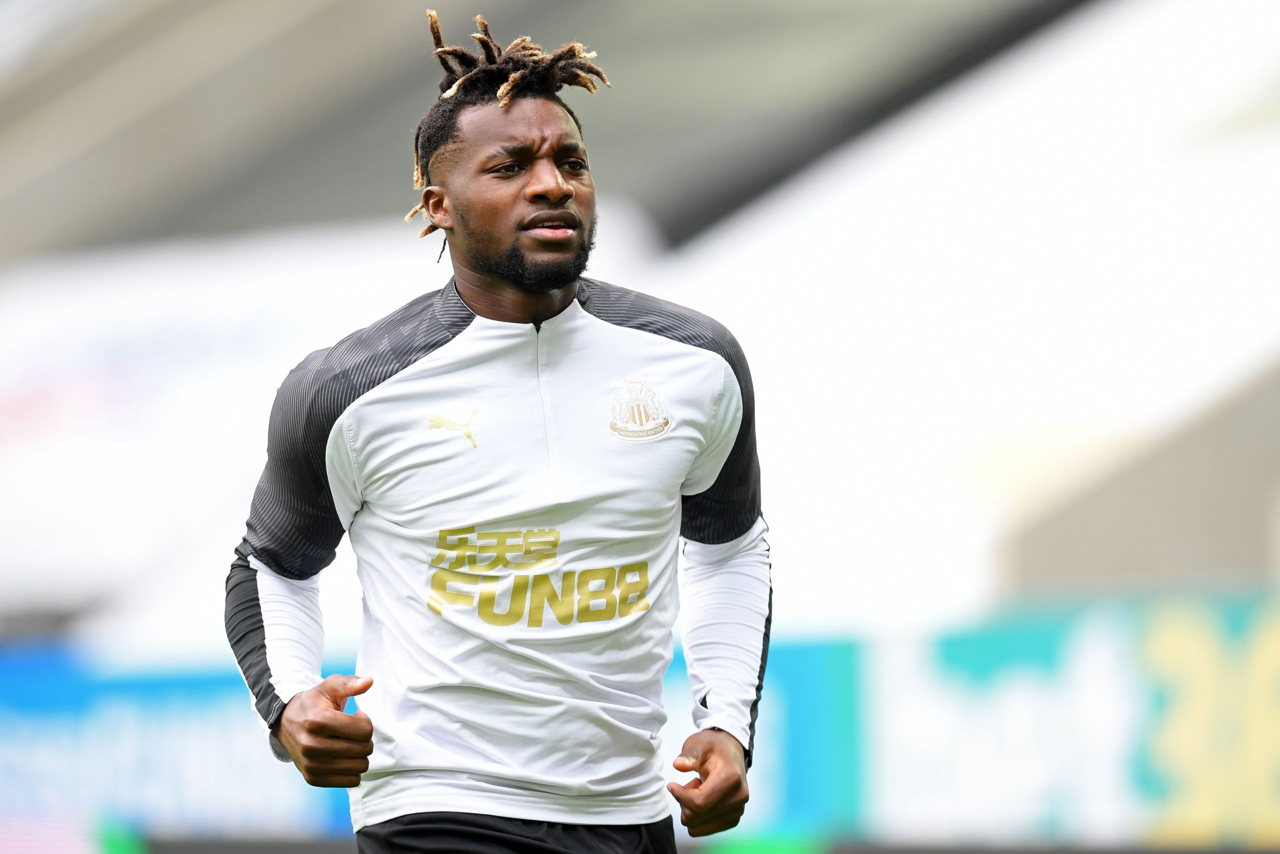 Newcastle United's French midfielder Allan Saint-Maximin warms up ahead of the English Premier League football match between Newcastle United and Tottenham Hotspur at St James' Park in Newcastle-upon-Tyne, north-east England on July 15, 2020. (Photo by Michael Regan / POOL / AFP) / RESTRICTED TO EDITORIAL USE. No use with unauthorized audio, video, data, fixture lists, club/league logos or 'live' services. Online in-match use limited to 120 images. An additional 40 images may be used in extra time. No video emulation. Social media in-match use limited to 120 images. An additional 40 images may be used in extra time. No use in betting publications, games or single club/league/player publications. / (Photo by MICHAEL REGAN/POOL/AFP via Getty Images)