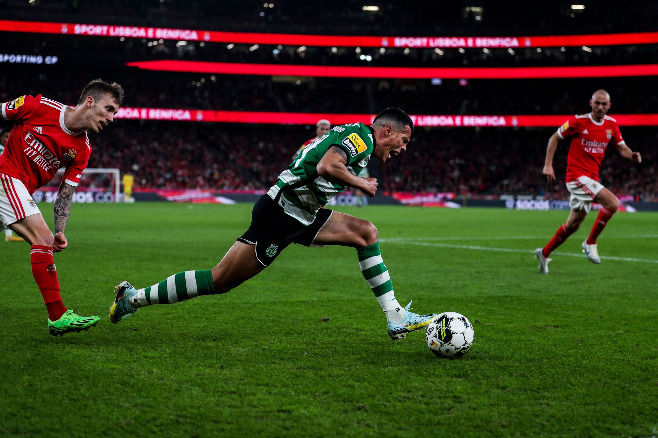 Benfica's Spanish midfielder Alex Grimaldo (L) vies with Sporting's Spanish midfielder Pedro Porro during the Portuguese League football match between SL Benfica and Sporting CP at the Luz stadium in Lisbon on January 15, 2023.
