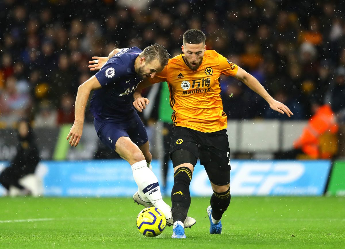 Harry Kane of Tottenham Hotspur is challenged by Matt Doherty of Wolverhampton Wanderers during a game in the 2018-18 season. 