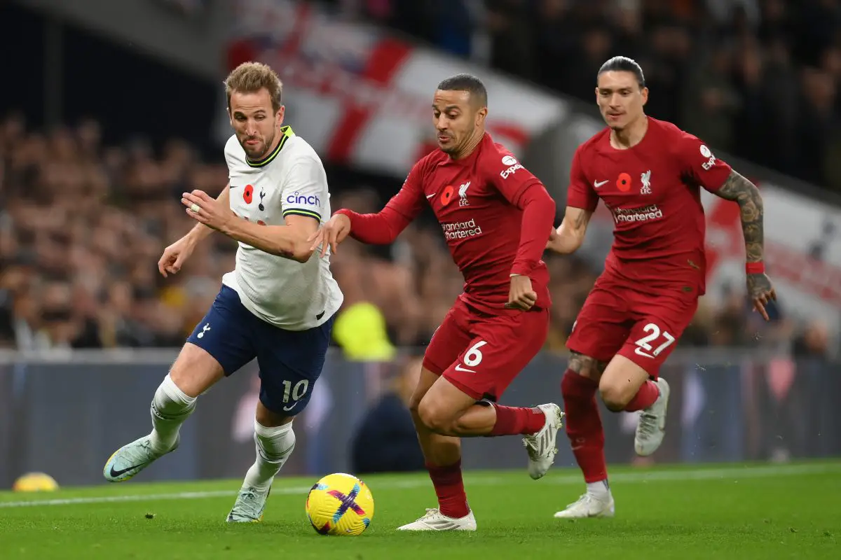 Harry Kane of Tottenham Hotspur is challenged by Thiago Alcantara of Liverpool as Darwin Nunez watches on. 
