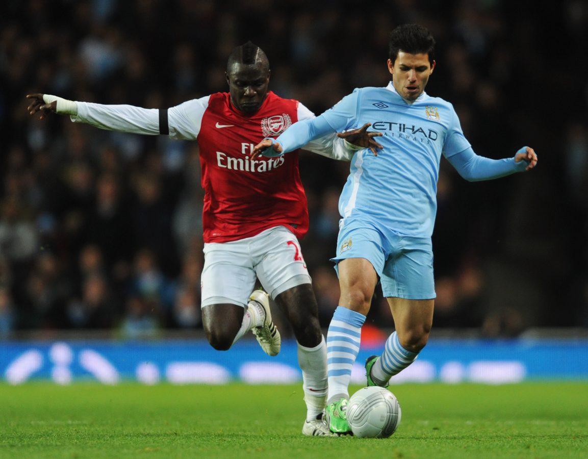 Emmanuel Frimpong of Arsenal battles with Sergio Aguero of Manchester City - November 2011.