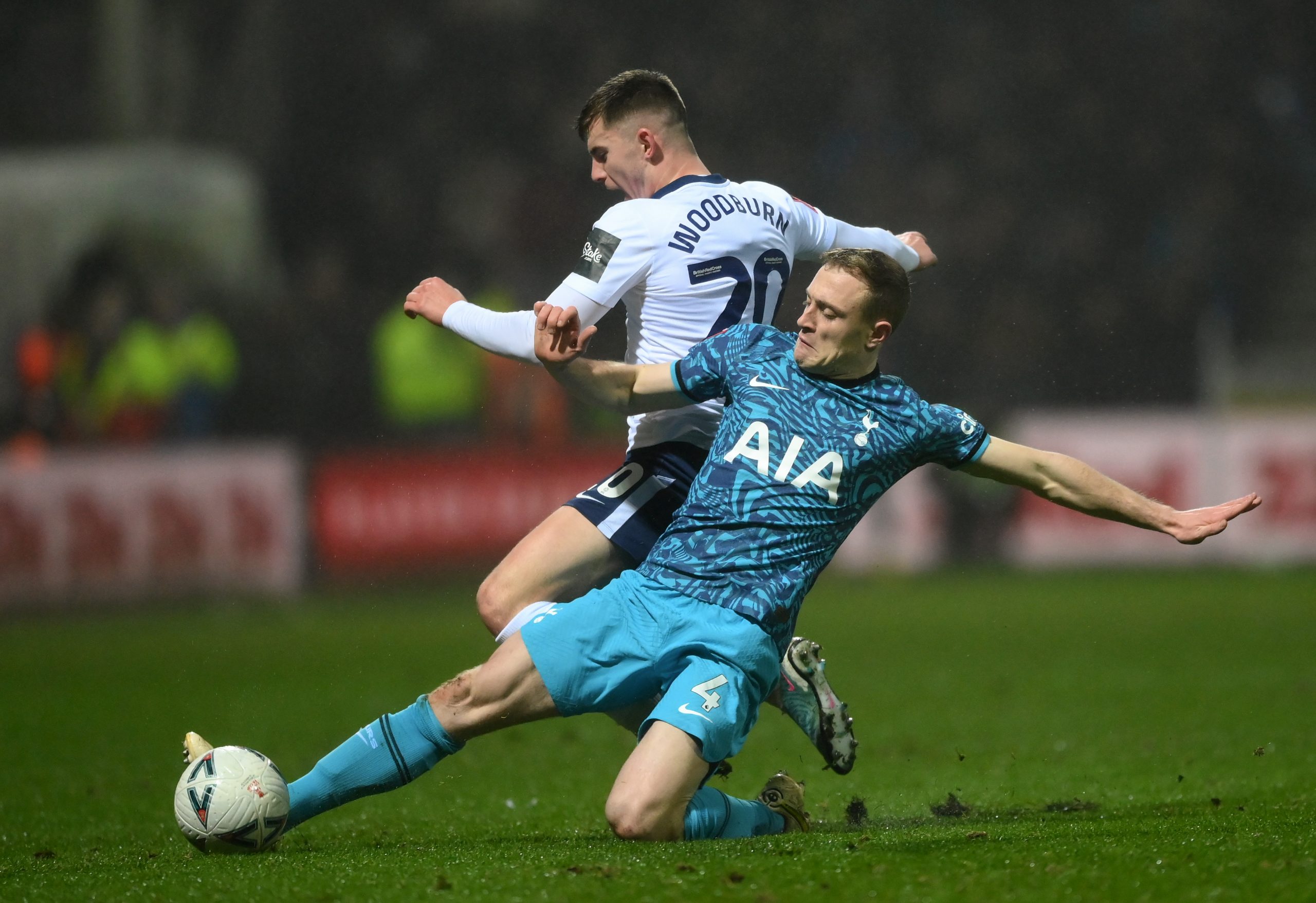 Oliver Skipp of Tottenham Hotspur is challenged by Ben Woodburn of Preston North End.