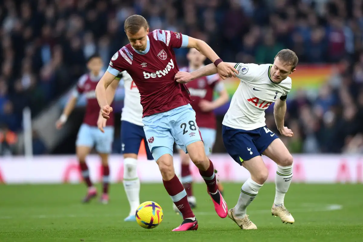 Tomas Soucek of West Ham United and Oliver Skipp of Tottenham Hotspur compete for the ball. 