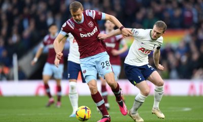 Tomas Soucek of West Ham United and Oliver Skipp of Tottenham Hotspur compete for the ball.
