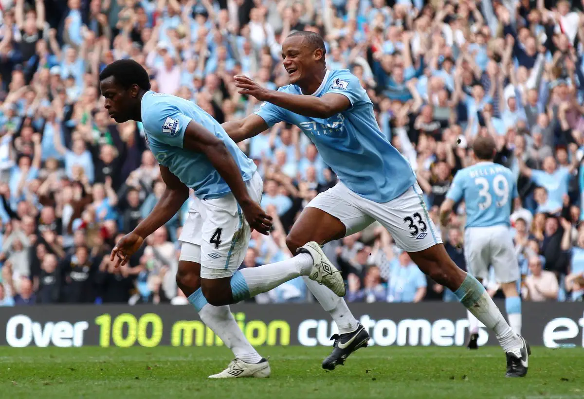  Nedum Onuoha of Manchester City celebrates scoring a goal with Vincent Kompany. 