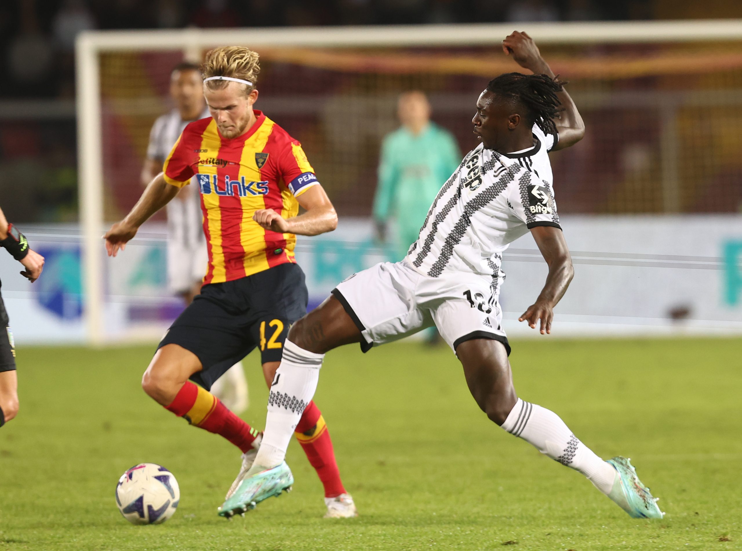 Morten Hjulmand of Lecce competes for the ball with Moise Kean of Juventus.