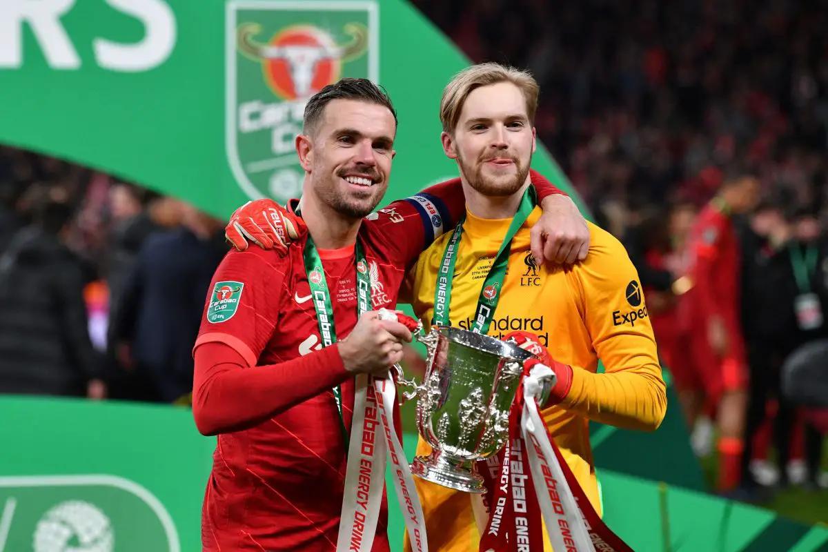 Liverpool's Jordan Henderson and Caoimhin Kelleher hold the EFL Cup trophy.