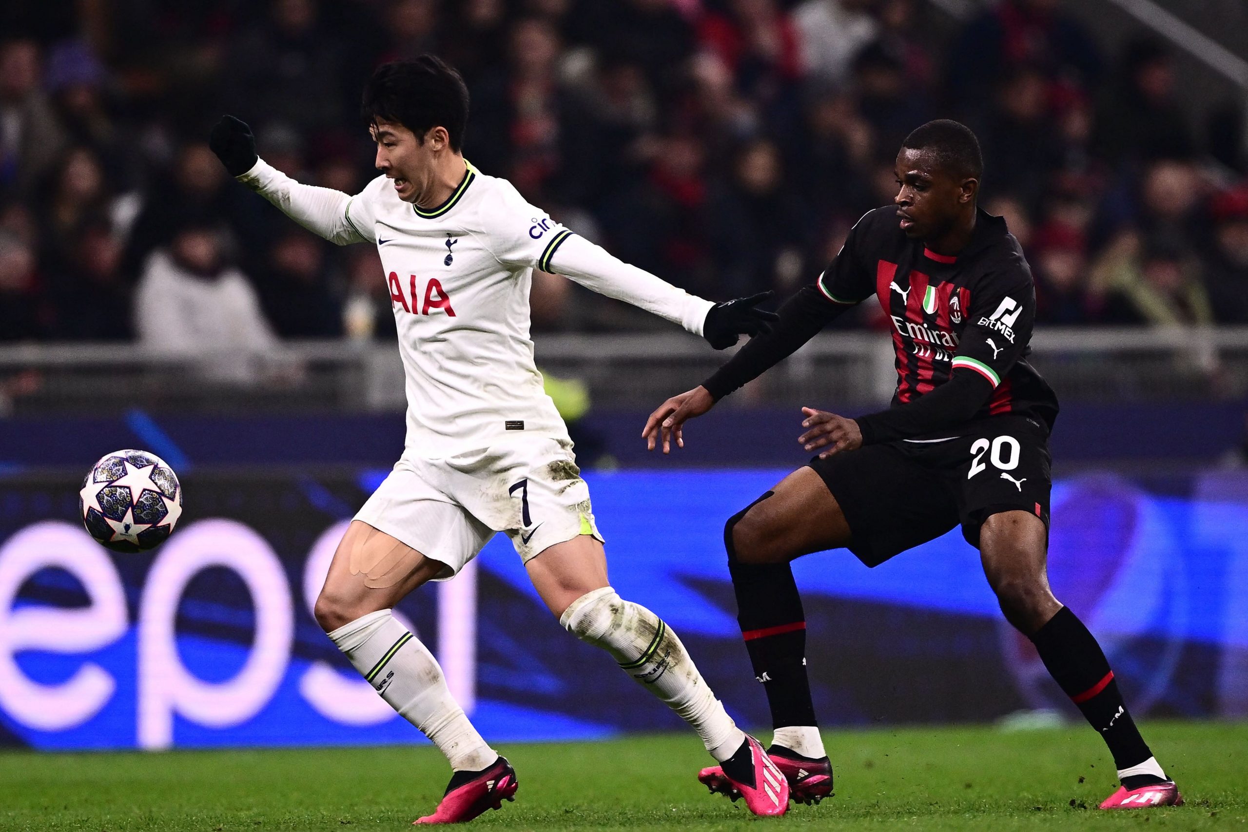 Tottenham Hotspur's South Korean striker Son Heung-Min works around AC Milan's French defender Pierre Kalulu.