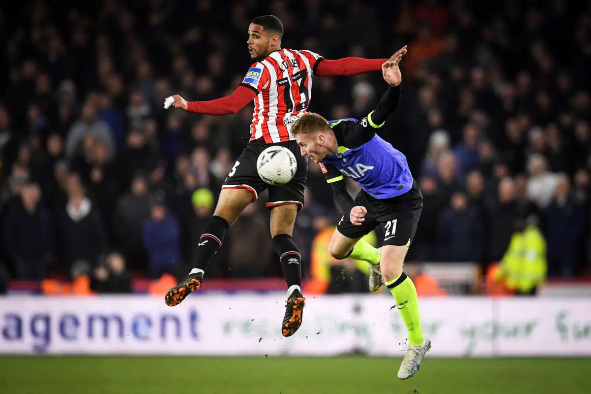 Sheffield United's Max Lowe fights for the ball with Tottenham Hotspur's Dejan Kulusevski. 