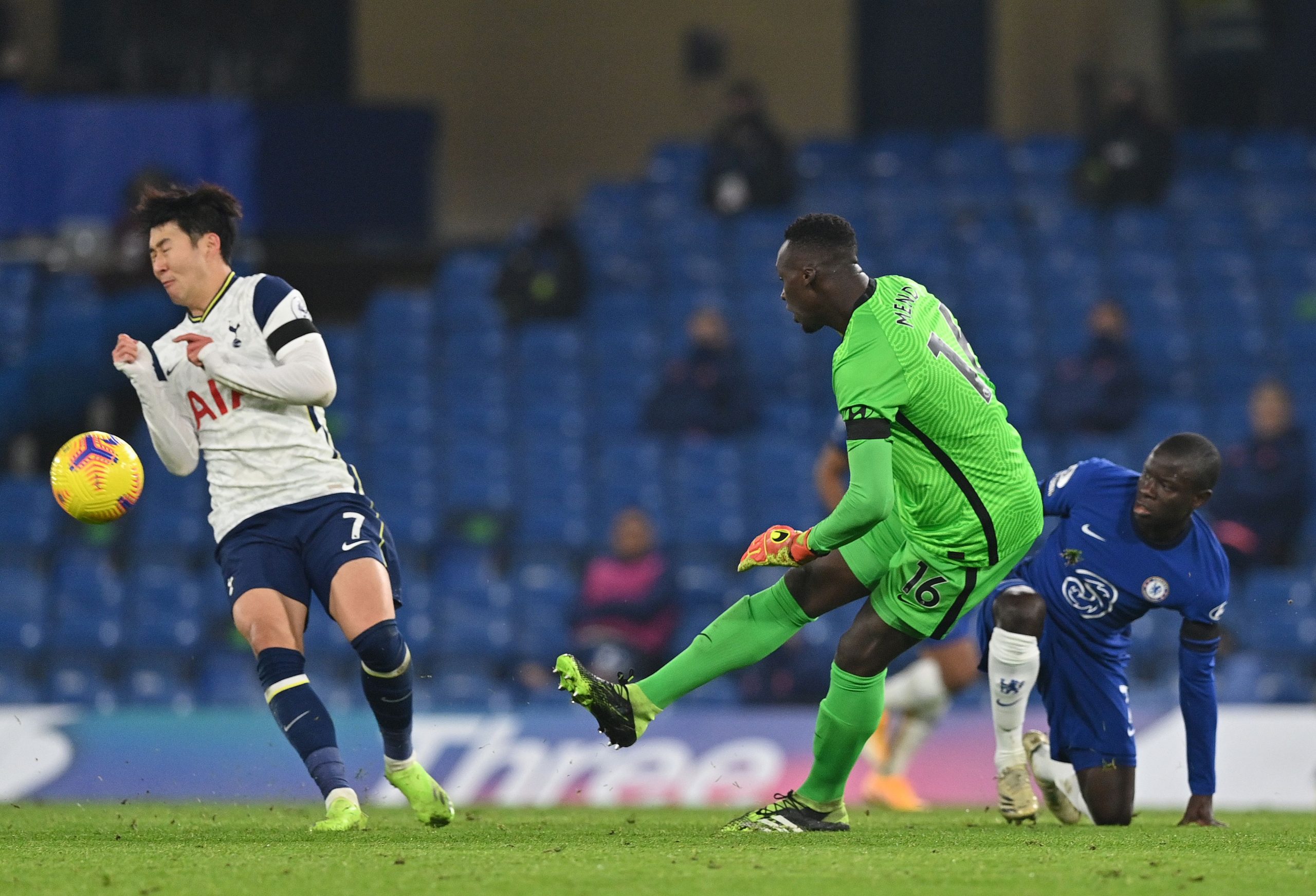 Chelsea's Senegalese goalkeeper Edouard Mendy clears the ball away from Tottenham Hotspur's South Korean striker Son Heung-min.