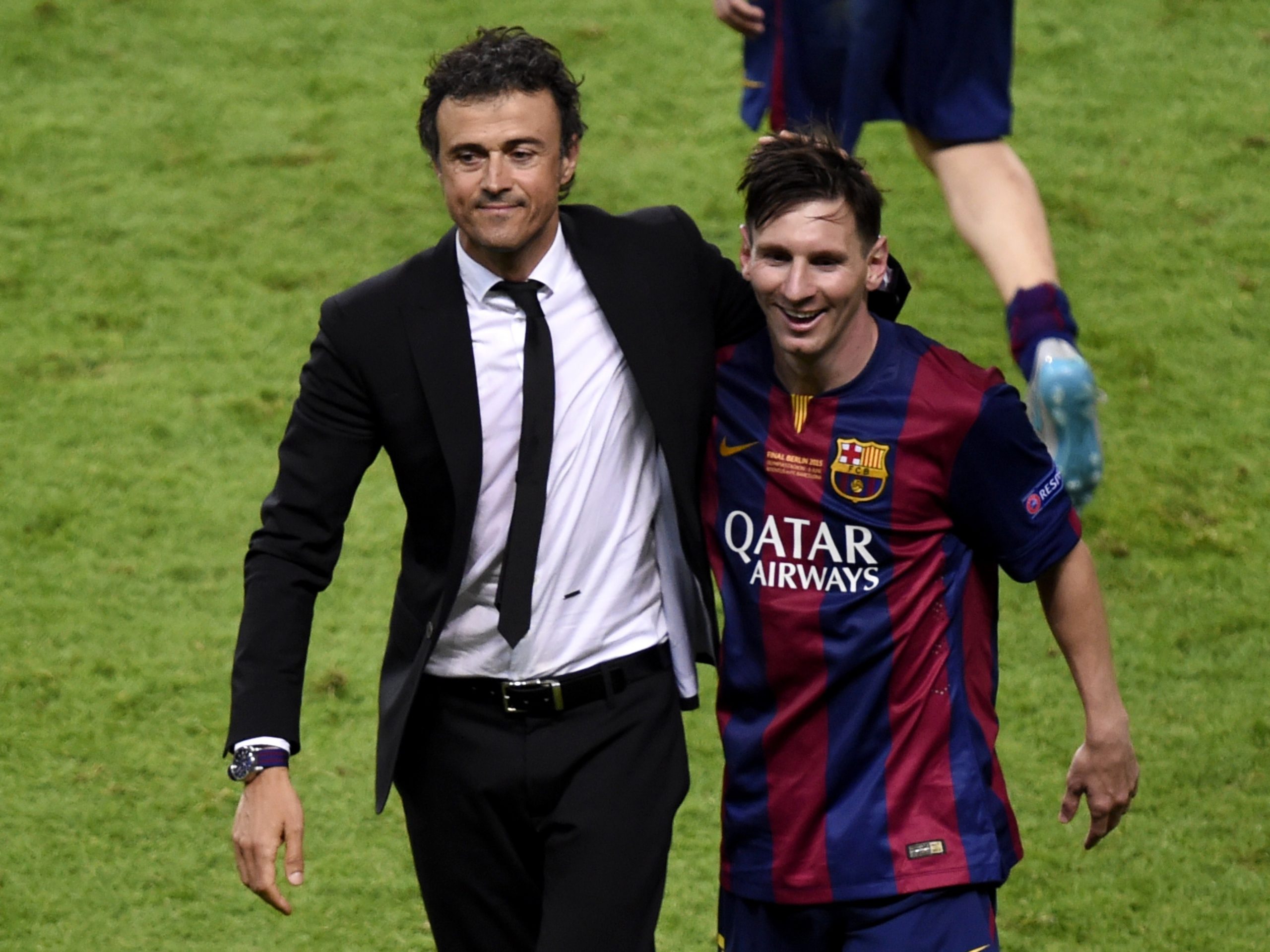 Barcelona's coach Luis Enrique and Lionel Messi celebrate after winning the UEFA Champions League.