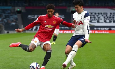 Marcus Rashford of Manchester United attempts a cross whilst under pressure from Son Heung-Min of Tottenham Hotspur.