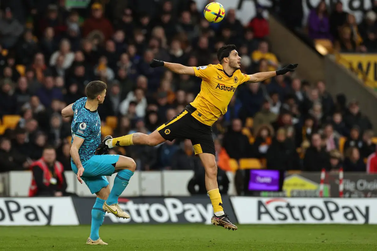 Raul Jimenez of Wolverhampton Wanderers stretches for the ball whilst under pressure from Clement Lenglet of Tottenham Hotspur. 