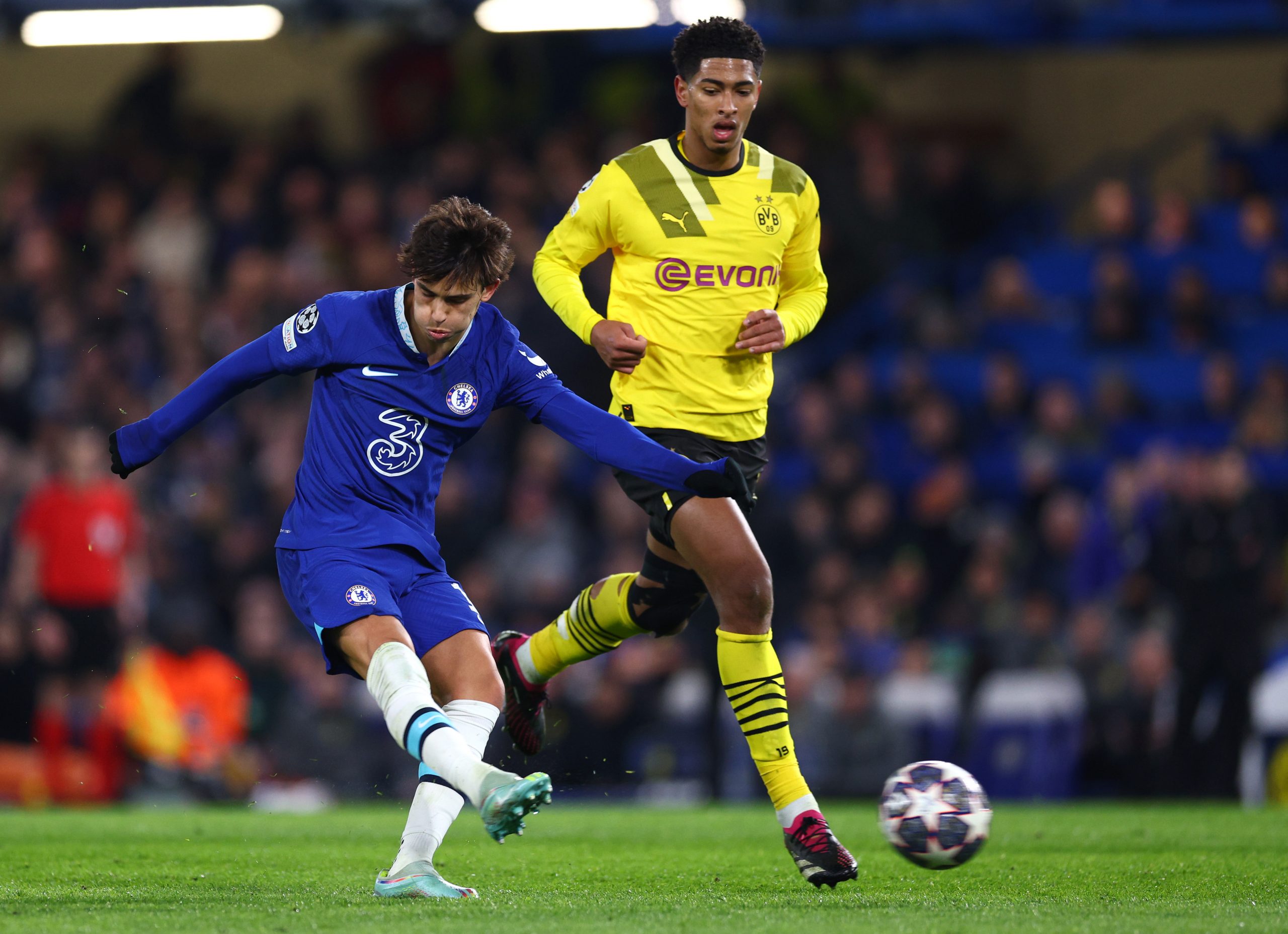 Joao Felix of Chelsea shoots whilst under pressure from Jude Bellingham of Borussia Dortmund.