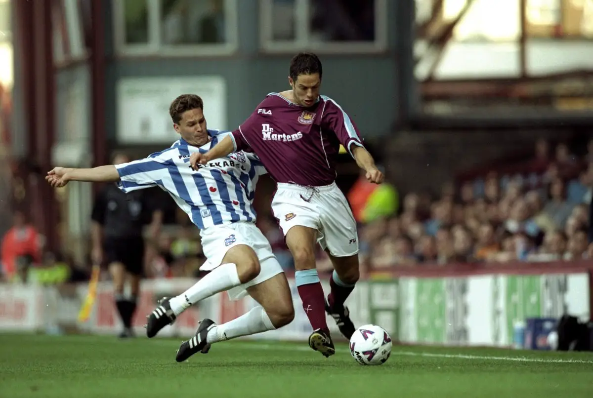 Scott Minto of West Ham United in action against Ark Radomski of Heerenveen during the Inter-Toto Cup Semi-Final.