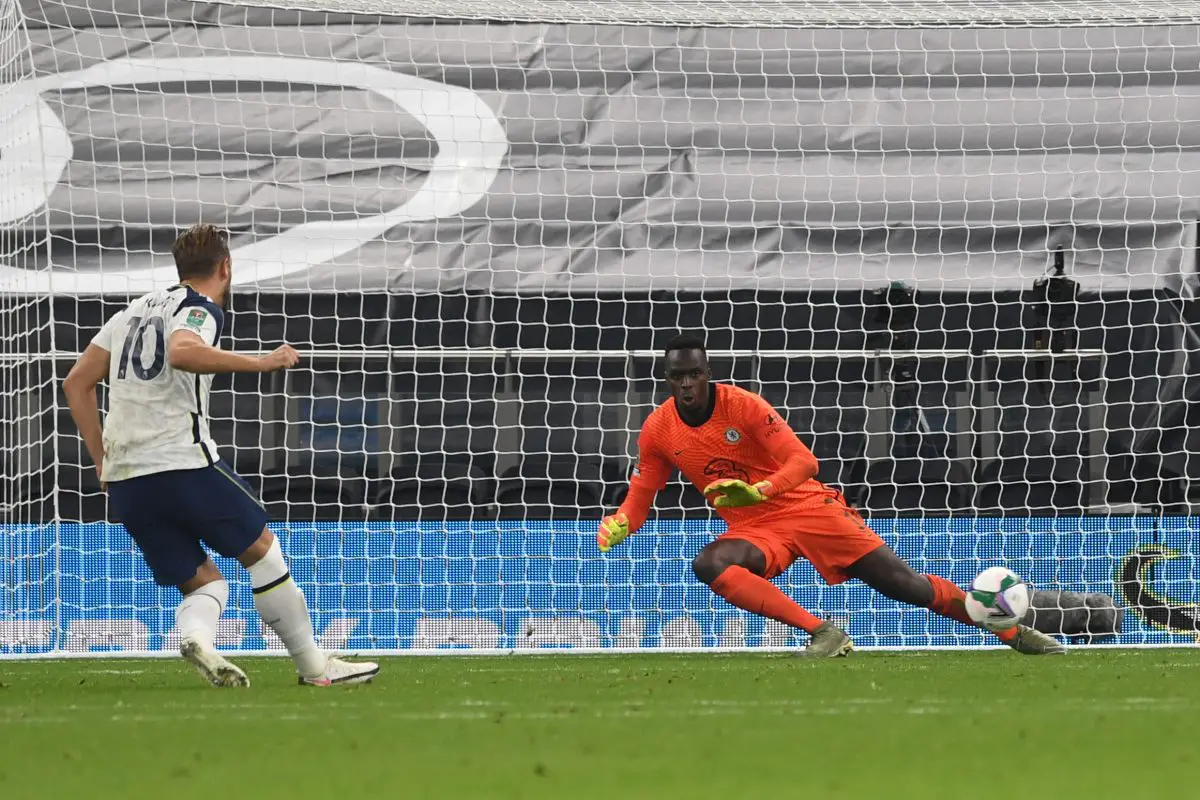 Tottenham Hotspur's English striker Harry Kane scores his penalty past Chelsea's French goalkeeper Edouard Mendy. 