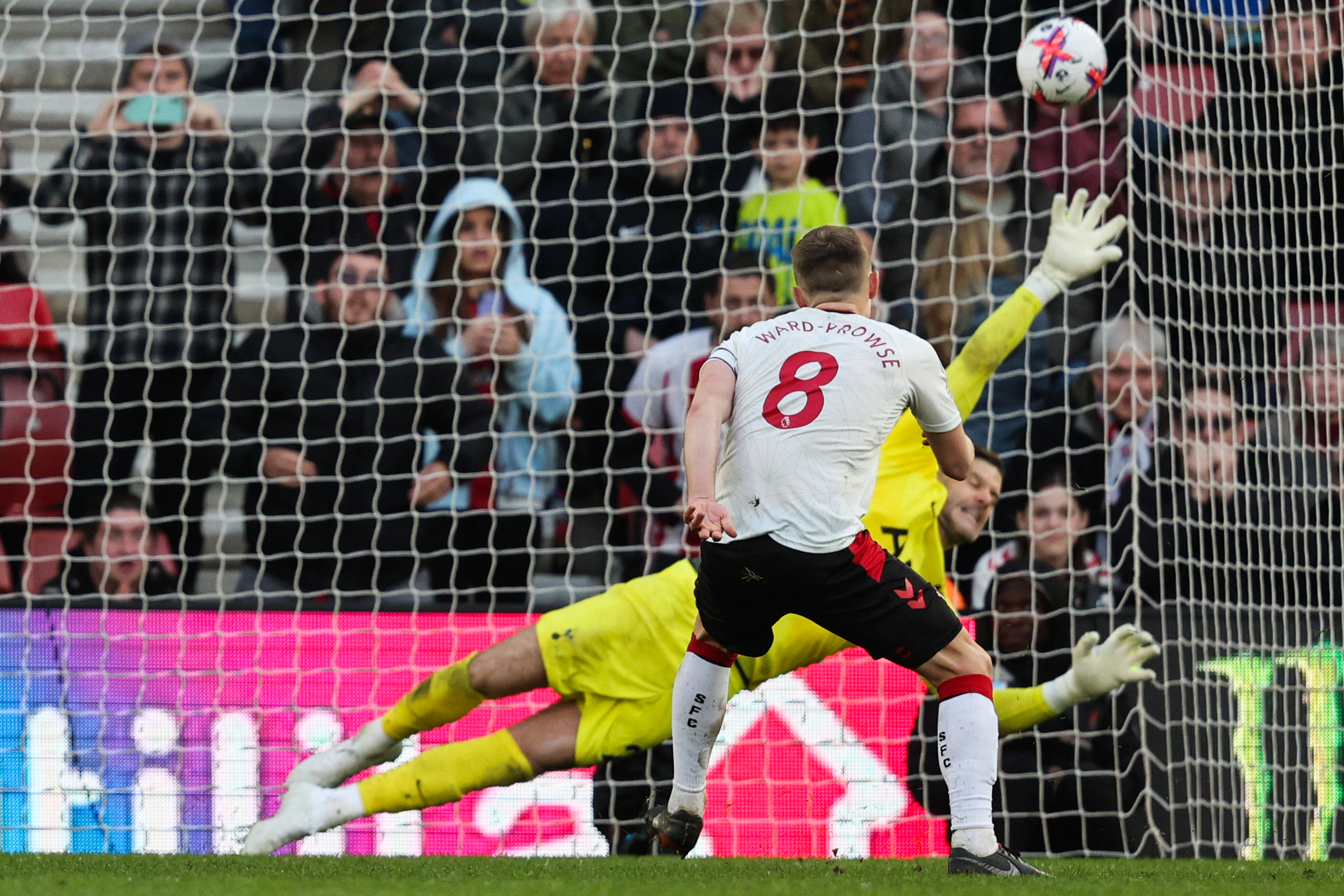 Southampton's English midfielder James Ward-Prowse shoots a penalty kick past Tottenham Hotspur's Fraser Forster.