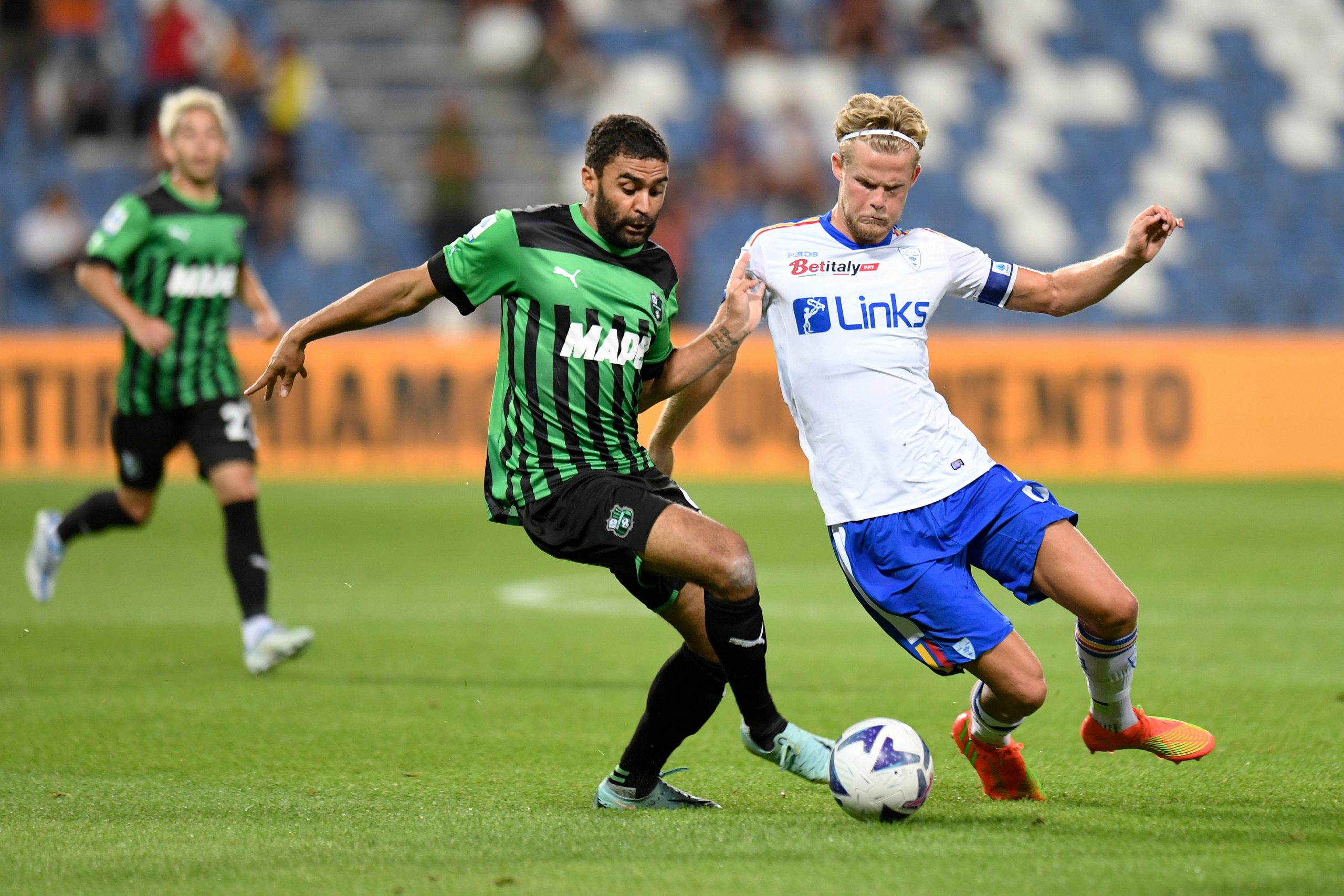 Gregoire Defrel of US Sassuolo is challenged by Morten Hjulmand of US Lecce.