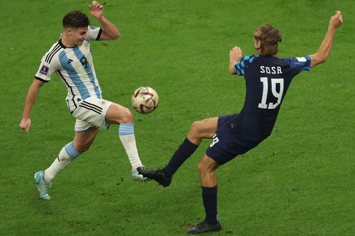 Argentina's Julian Alvarez fights for the ball with Croatia's Borna Sosa. 