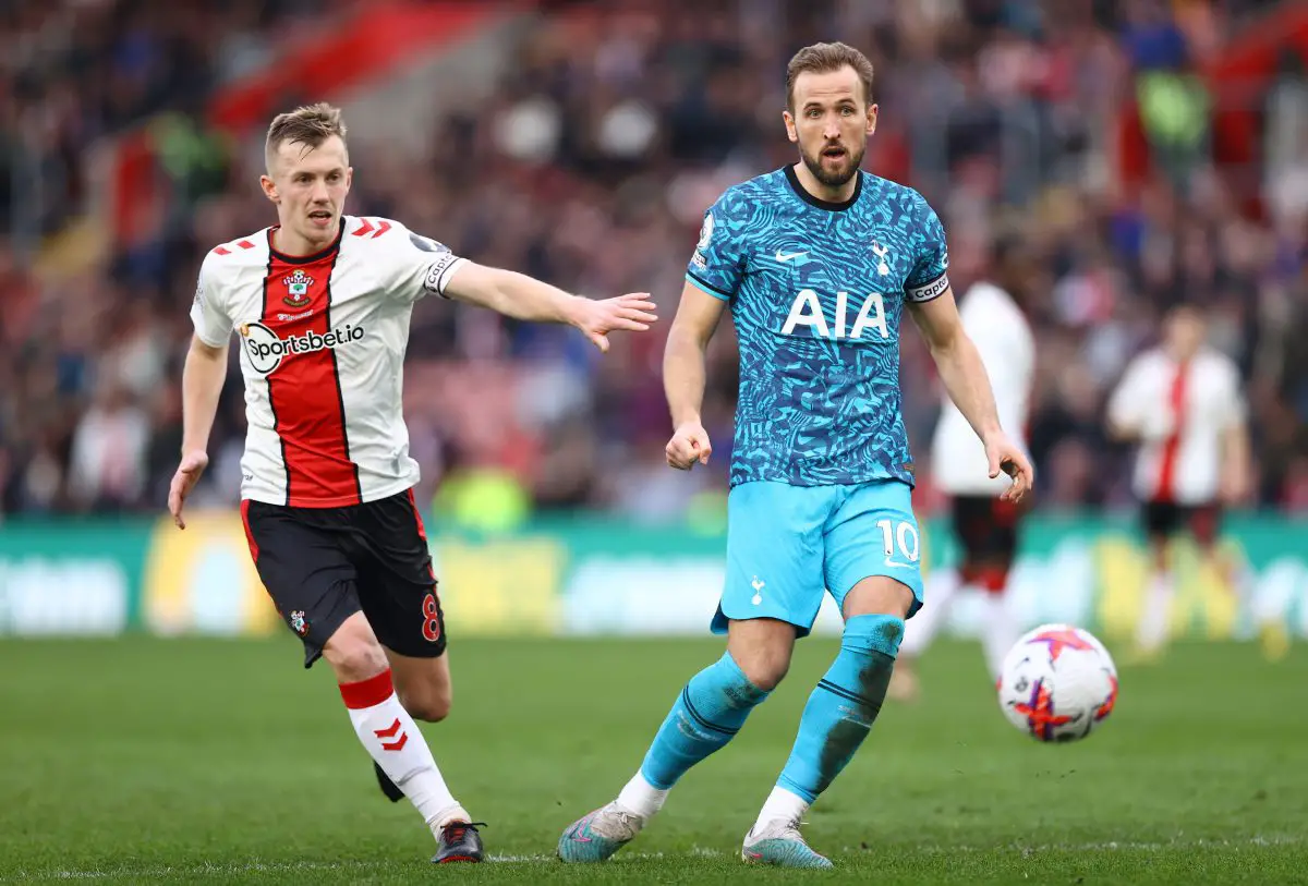 Harry Kane of Tottenham Hotspur passes the ball while under pressure from James Ward-Prowse of Southampton. 