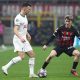 Ivan Perisic of Tottenham Hotspur is challenged by Alexis Saelemaekers of AC Milan.
