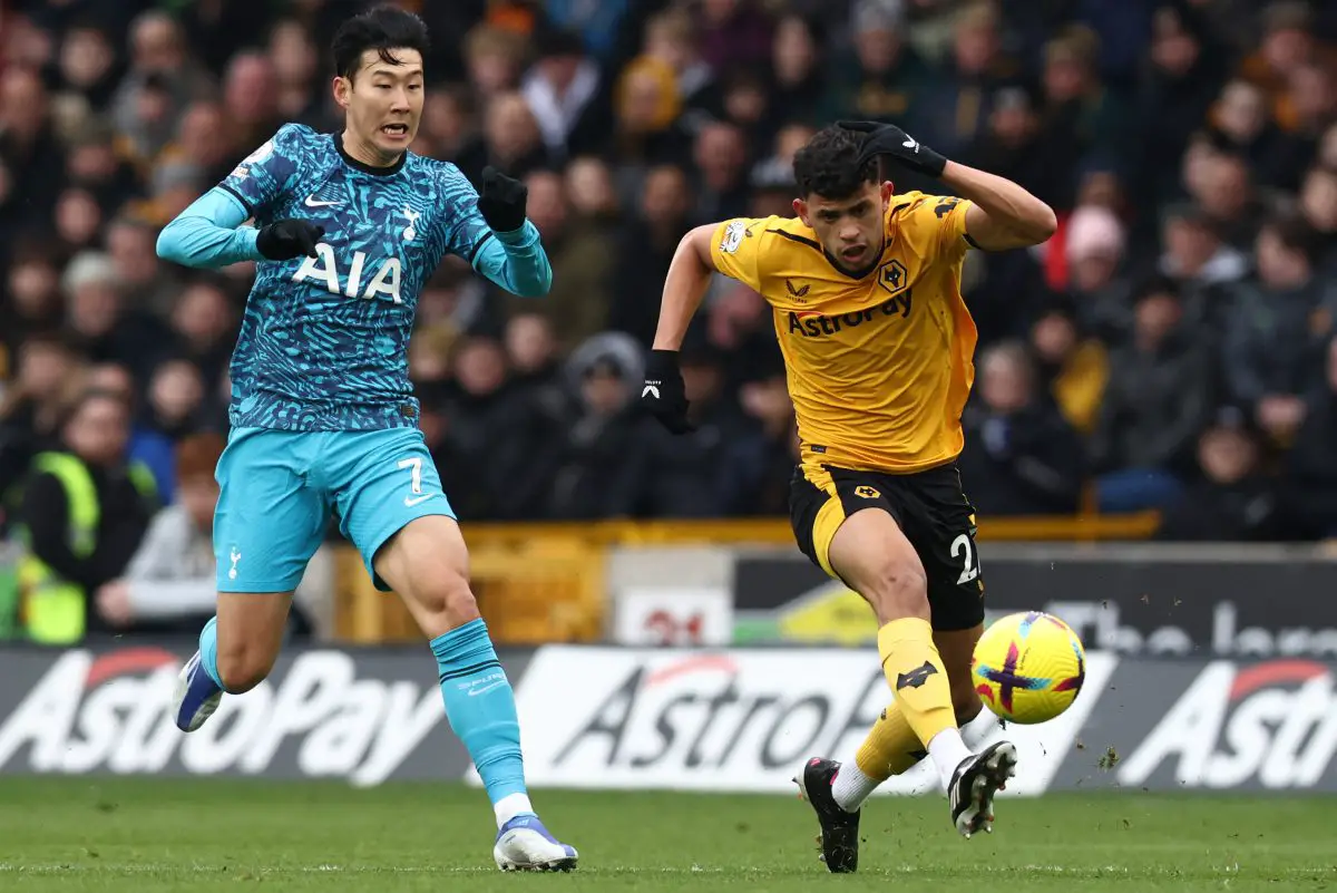 Wolverhampton Wanderers' Matheus Nunes runs with the ball past Tottenham Hotspur's Son Heung-min. 