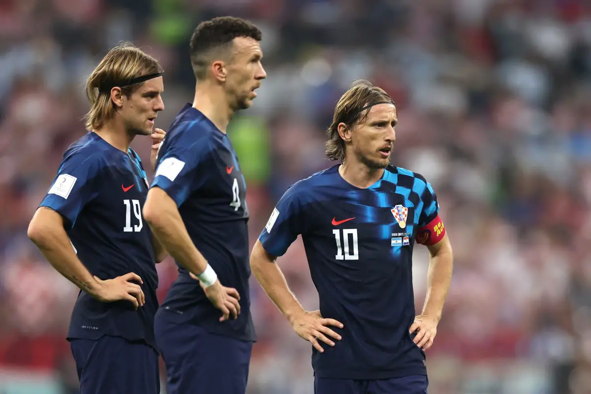 Borna Sosa, Ivan Perisic and Luka Modric of Croatia at the 2022 FIFA World Cup. 