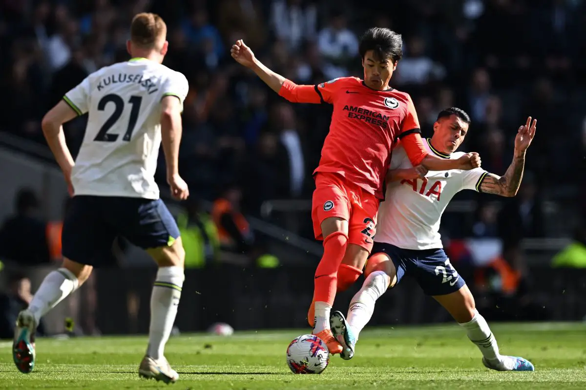 Tottenham Hotspur's Spanish defender Pedro Porro vies with Brighton's Japanese midfielder Kaoru Mitoma.