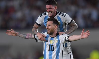 Lionel Messi of Argentina celebrates after scoring with teammate Rodrigo De Paul.