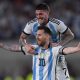 Lionel Messi of Argentina celebrates after scoring with teammate Rodrigo De Paul.