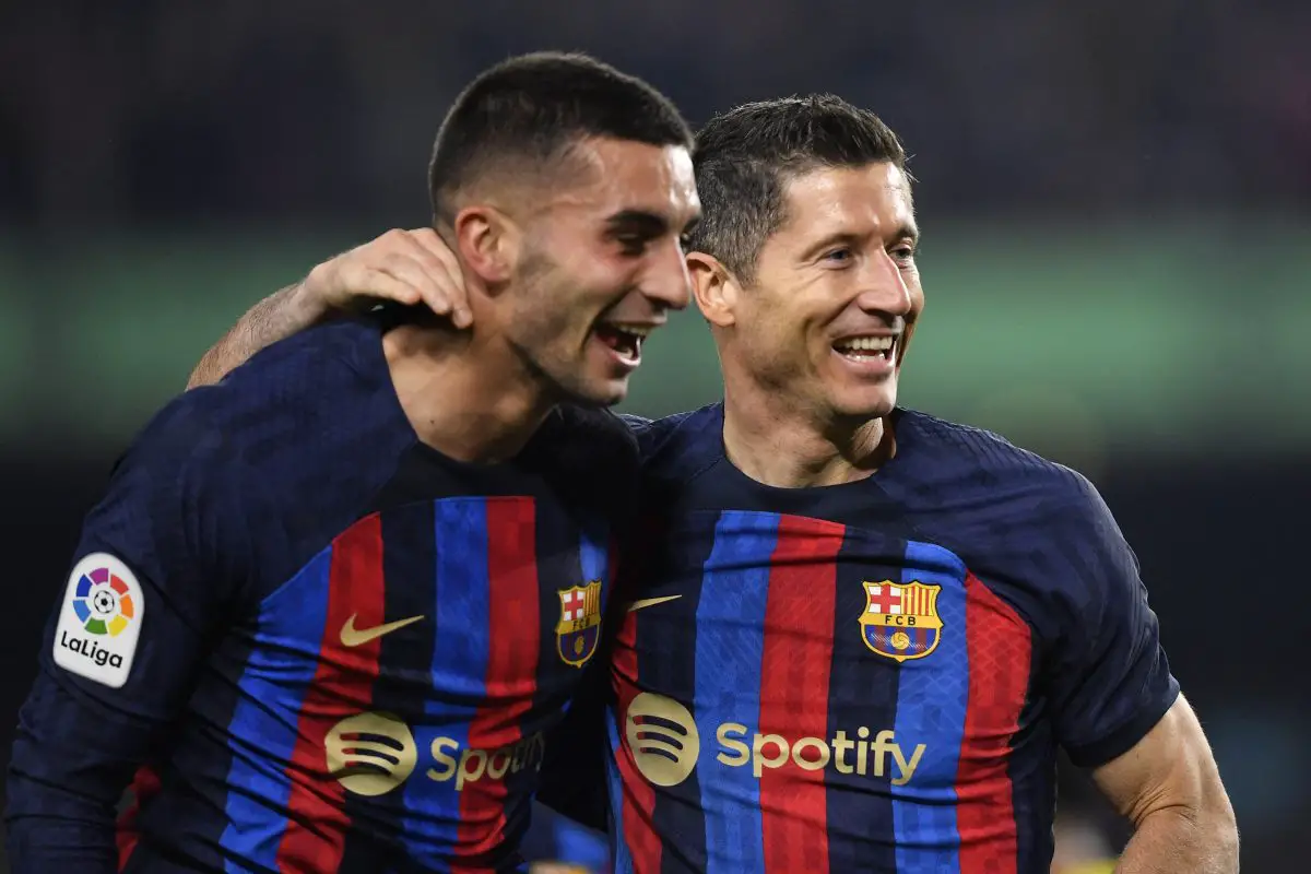 Barcelona's Polish forward Robert Lewandowski celebrates scoring with Ferran Torres. 