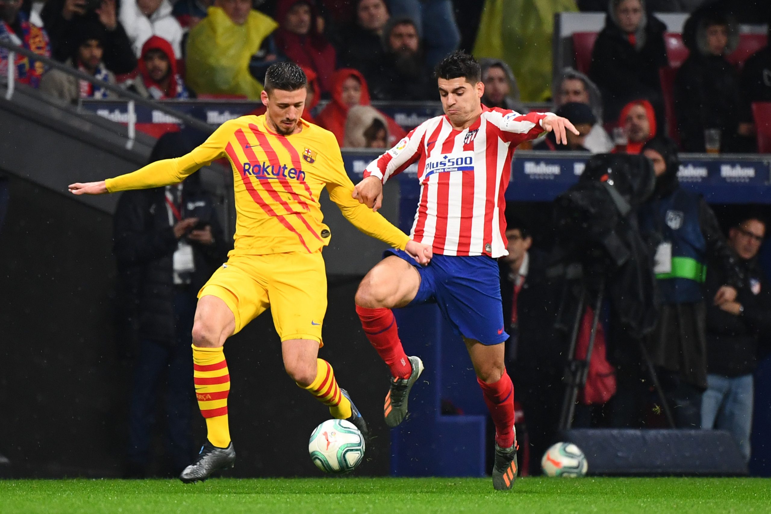 Barcelona's French defender Clement Lenglet challenges Atletico Madrid's Alvaro Morata.