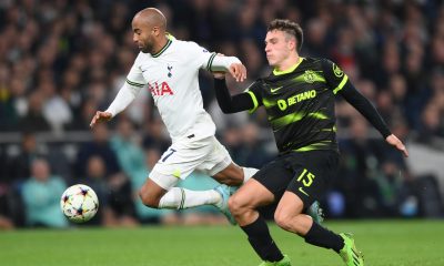 Lucas Moura of Tottenham Hotspur is challenged by Manuel Ugarte of Sporting CP.
