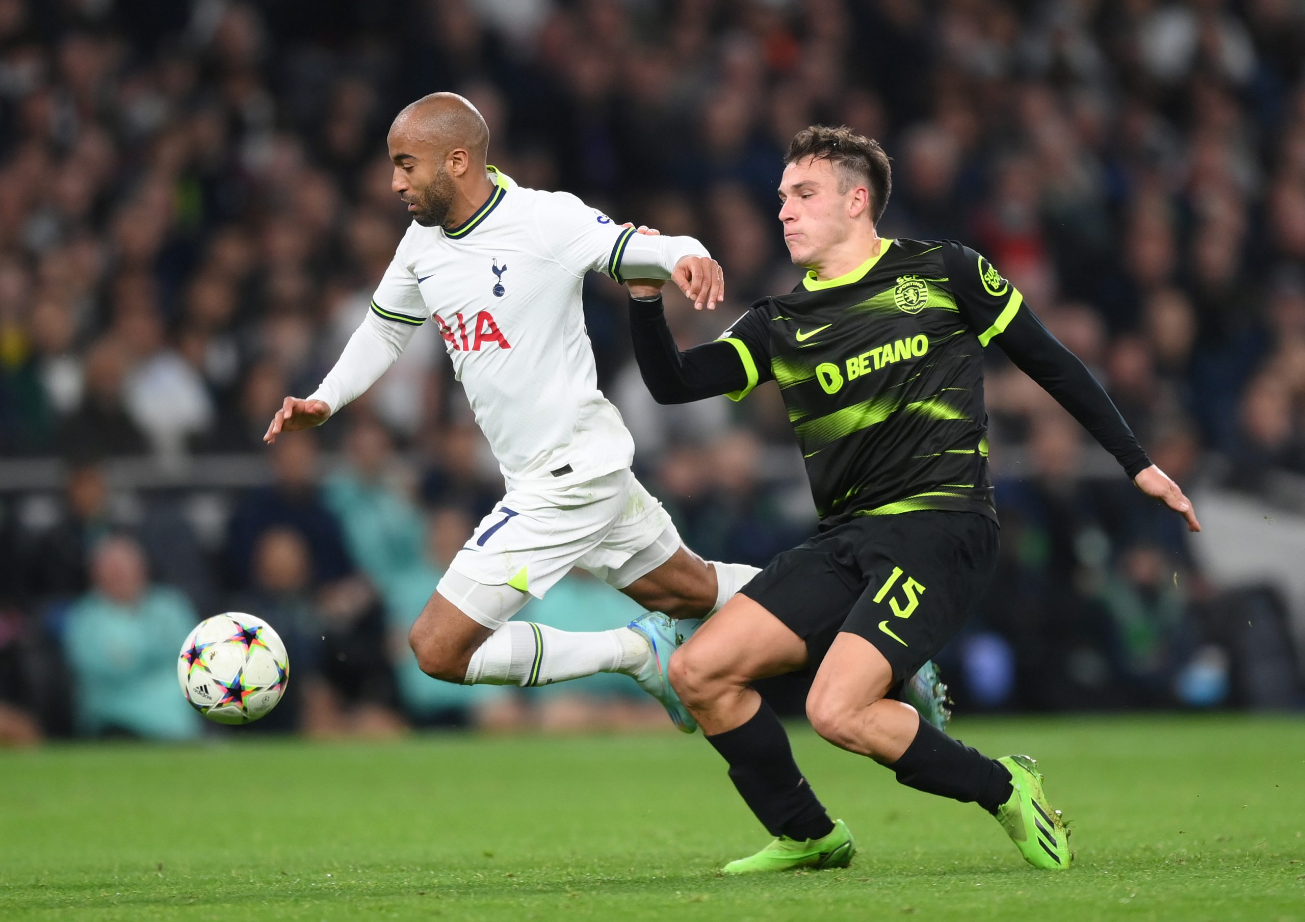 Lucas Moura of Tottenham Hotspur is challenged by Manuel Ugarte of Sporting CP.