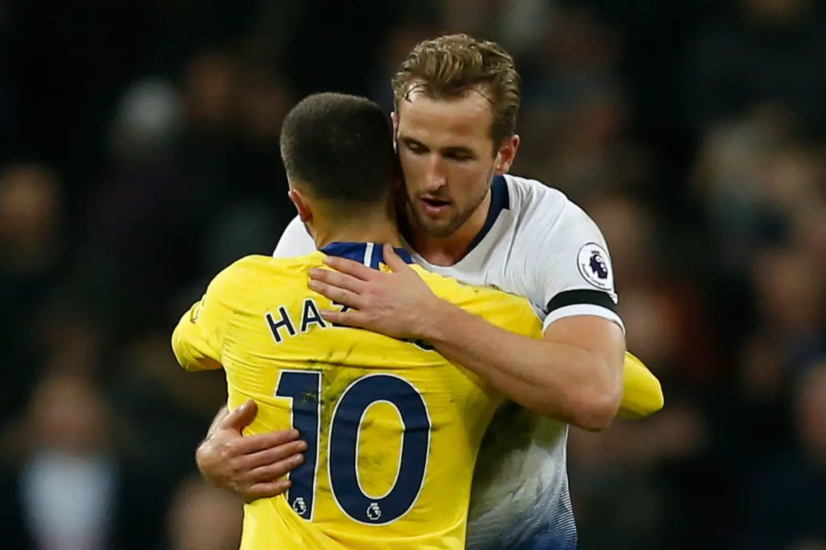 Tottenham Hotspur's English striker Harry Kane embraces Belgian midfielder Eden Hazard.