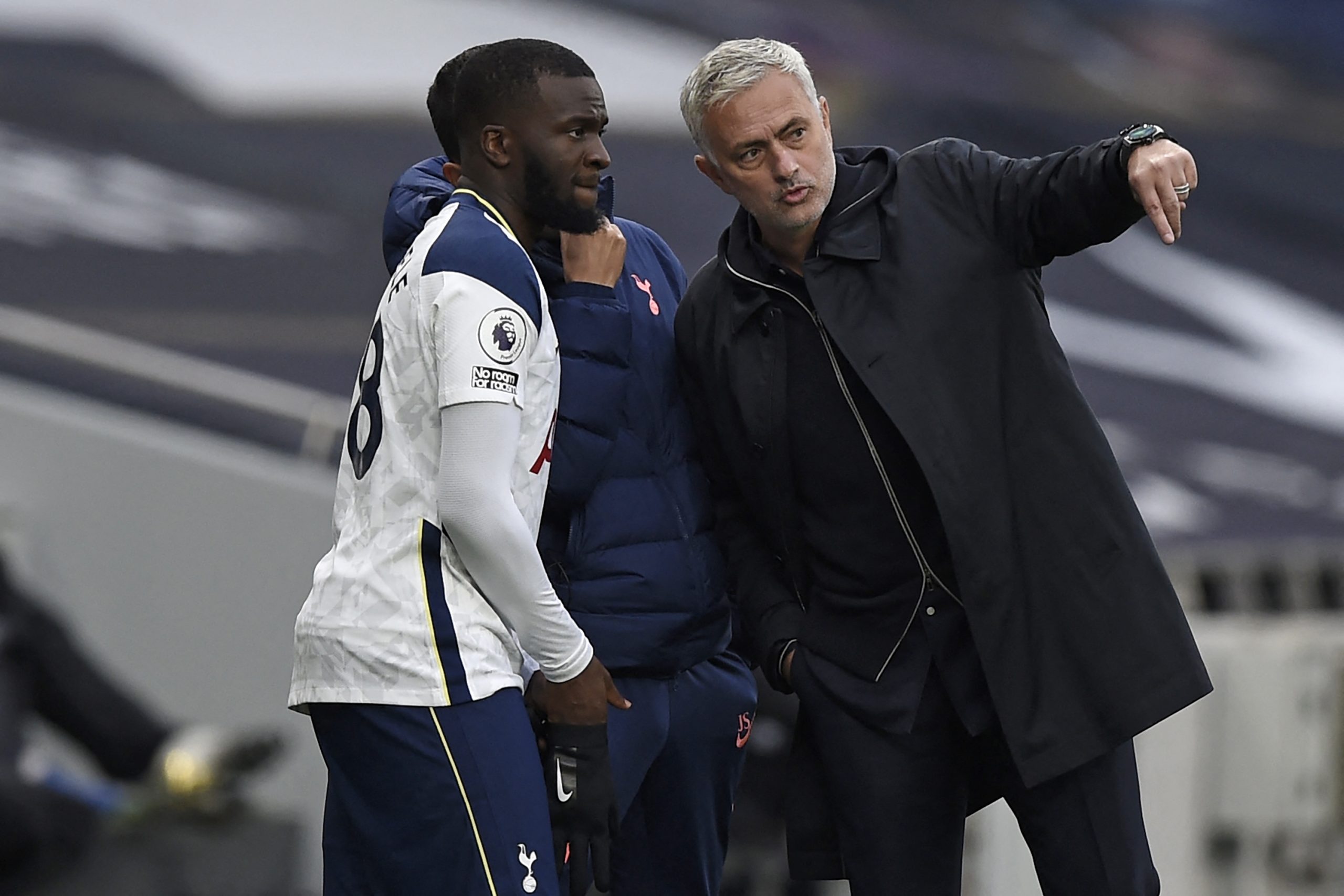 Mourinho speaks with Tottenham Hotspur's French midfielder Tanguy Ndombele.