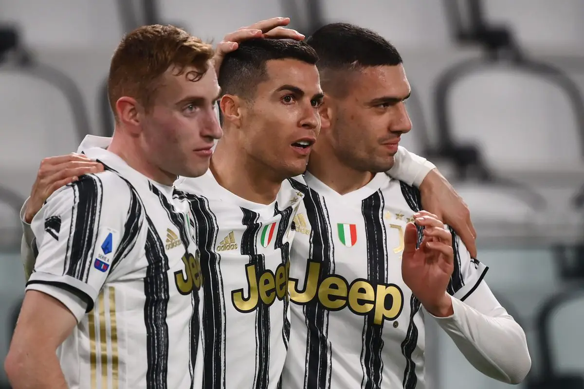 Juventus' Cristiano Ronaldo with Dejan Kulusevski and Merih Demiral after scoring. (Photo by MARCO BERTORELLO/AFP via Getty Images)