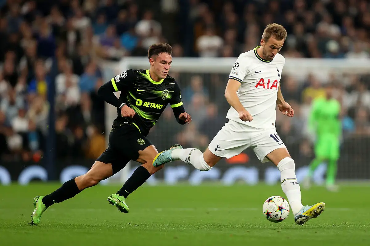 Harry Kane of Tottenham Hotspur is challenged by Manuel Ugarte of Sporting CP. 