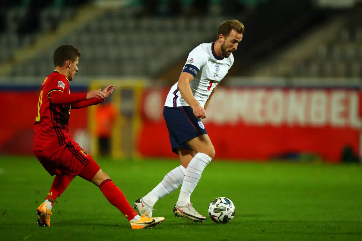 Harry Kane of England battles for possession with Thorgan Hazard (Eden's brother) of Belgium.
